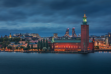 Illuminated Stockholm skyline at night with Stadshus in Sweden