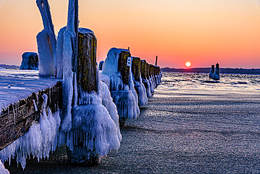 Icy old wooden pier on the beach, Travemünde, Bay of Lübeck, Schleswig Holstein, Germany