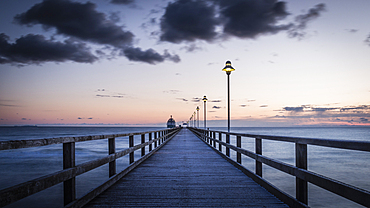 Long exposure at the pier in Zinnowitz on Usedom in the blue hour at sunrise, Germany, Mecklenburg-Western Pomerania, Baltic Sea