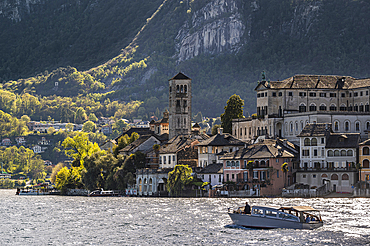 Motorboat in front of island, view of Isola San Giulio from the port of Orta San Giulio, Lake Orta is a northern Italian lake in the northern Italian, Lago d'Orta, or Cusio, region of Piedmont, Italy, Europe