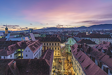 View from the Schlossberg to a Christmas market in the old town of Graz, Styria, Austria.