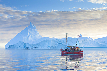 Tourist boat in front of icebergs, Kangia Icefjord, Disko Bay, UNESCO World Heritage Site, West Greenland, Greenland