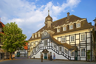 Town hall (half-timbered house from 1804) and sculpture called Augenblicke by Christel Lechner, Rietberg, Kreis Guetersloh, Teutoburger Wald, Northrhine-Westphalia, Germany, Europe