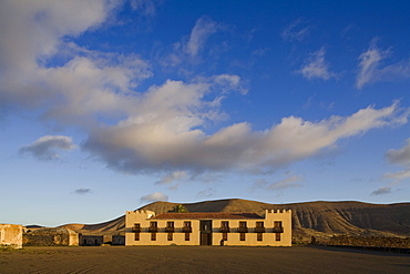 The historical building Casa de Los Coroneles under clouded sky, La Oliva, Fuerteventura, Canary Islands, Spain, Europe