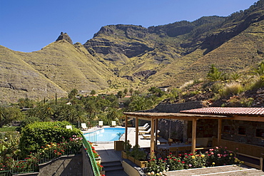 Terrace and pool of holiday home Las Rosas under blue sky, Faneque mountain, Valley of El Risco, Parque Natural de Tamadaba, Gran Canaria, Canary Islands, Spain, Europe