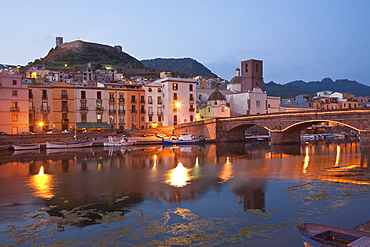 Bridge above the river Fiume Temo and the Castello di Serravalle at dusk, Bosa, Sardinia, Italy, Europe