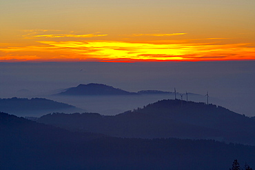 View from the mountain Kandel over the Black Forest with wind energy plants on the Rosskopf, Winter, Sunset, Baden-Wuerttemberg, Germany, Europe