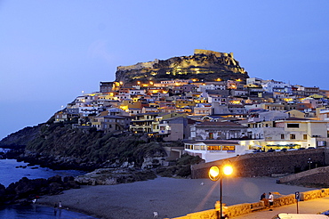 Houses and castle on the waterfront in the evening, Castelsardo, North Sardinia, Italy, Europe