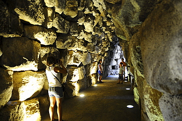 Tourists at the fortress Nuraghe Santu Antine at Valle de Nuraghi, Sardinia, Italy, Europe