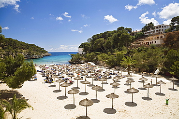 Sandy beach with sunshades at the bay of Cala Santanyi, Mallorca, Balearic Islands, Spain, Europe