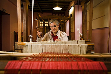 Female silk weaver sitting at a hand loom, workshop, Las Hiladeras El Paso, El Paso, La Palma, Canary Islands, Spain, Europe