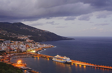 Cruise ship, Crucero Aida, in the harbour Santa Cruz de la Palma at dusk, UNESCO Biosphere Reserve, La Palma, Canary Islands, Spain, Europe