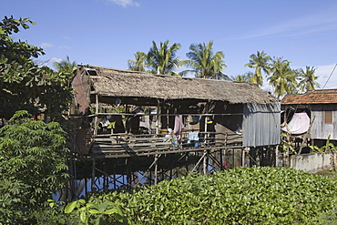 Huts on stilts at the island Koh Deik in the Mekong River, Cambodia, Asia