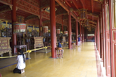 Praying woman at a temple, forbidden Purple City in the imperial town of Hue, Thua Thien-Hue Province, Vietnam, Asia