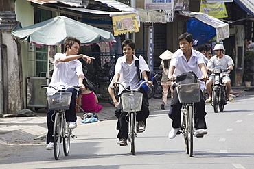 School boys on their bicycles at Can Tho, Mekong Delta, Can Tho Province, Vietnam, Asia