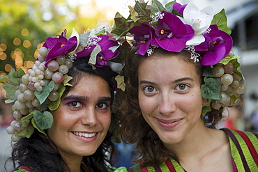 Two young women in colourful costumes at the Madeira Wine Festival, Funchal, Madeira, Portugal