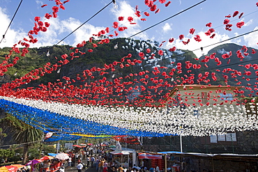 Colourful decorations and firework smoke at a religious festival, Ponta Delgada, Madeira, Portugal