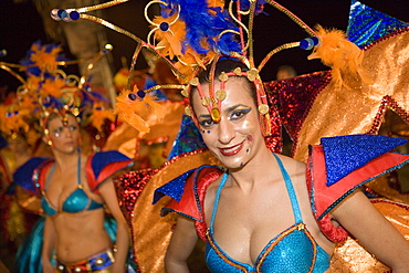 Woman in colourful costumes at the Carnival Parade, Funchal, Madeira, Portugal