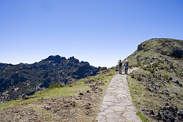 Two hikers on a trail to the Pico Ruivo Summit, Achada do Teixeira, Madeira, Portugal