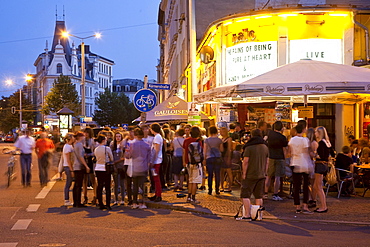 Young people in front of a nightclub, Leipzig, Saxony, Germany