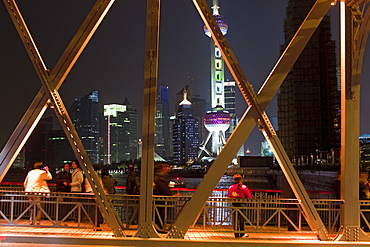 The illuminated Waibaidu bridge above the Souzhou canal at night, Bund, Shanghai, China, Asia