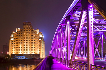 The illuminated Waibaidu bridge above the Souzhou canal at night, Bund, Shanghai, China, Asia