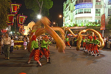 People at dragon dance during Tet festival at night, Saigon, Ho Chi Minh City, Vietnam, Asia