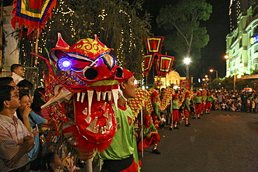 People at dragon dance during Tet festival at night, Saigon, Ho Chi Minh City, Vietnam, Asia