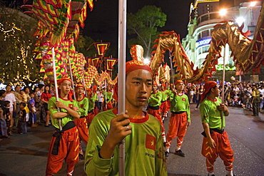 People at dragon dance during Tet festival at night, Saigon, Ho Chi Minh City, Vietnam, Asia