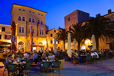 young couple in street cafe, Trg Municipija Arbe, Rab, Rab Island, Croatia