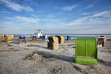 Roofed wicker beach chairs at beach, Carolinensiel-Harlesiel, East Frisia, Lower Saxony, Germany