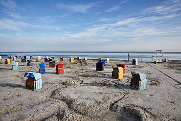 Roofed wicker beach chairs at beach, Carolinensiel-Harlesiel, East Frisia, Lower Saxony, Germany