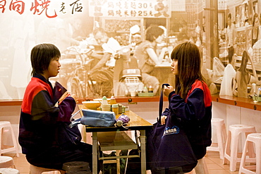 Two women at Taiwanese noodle restaurant Chi Kin Dandanmian, Tainan, Republic of China, Taiwan, Asia