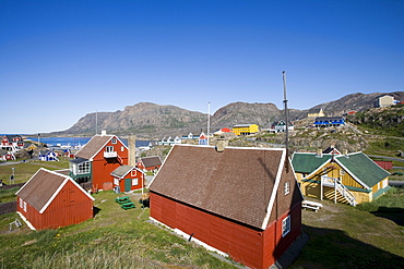 Wooden houses on the waterfront under blue sky, Sisimiut, Kitaa, Greenland