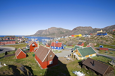 Wooden houses on the waterfront under blue sky, Sisimiut, Kitaa, Greenland