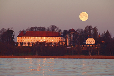 Rising moon over the old palace of Herrenchiemsee, Herreninsel, Lake Chiemsee, Chiemgau, Bavaria, Germany