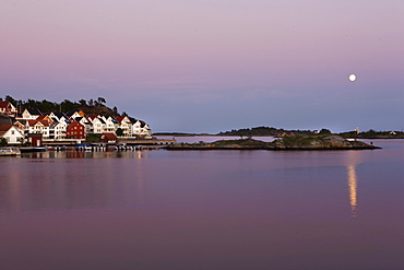 Houses at skerry coastline at sunset, Skagerrak, Sorland, Norway, Scandinavia, Europe