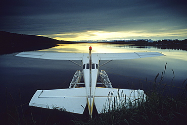 Floatplane at Beluga Lake under dark clouds, Kenai peninsula, Alaska, USA, United States of America