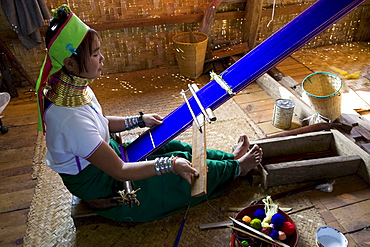 Longneck Intha women sitting at a loom at Inle Lake, Shan State, Myanmar, Burma