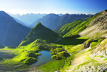 lake unterer Seewisee with hut Memminger Huette and Seekogel, Allgaeu range in background, Lechtal range, Tyrol, Austria