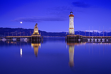 Lighthouse and sculpture of a lion at harbour in the evening, Lindau, Lake Constance, Baden Wurttemberg, Germany