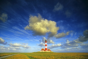 Westerhever lighthouse under cloudy sky, Eiderstedt peninsula, North Friesland, North Sea, Schleswig-Holstein, Germany