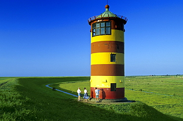 Lighthouse under blue sky, East Friesland, Lower Saxony, Germany