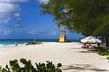 People sunbathing at Miami Beach, Oistins, Barbados, Caribbean