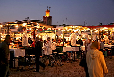 People at the market at dusk, Djamaa el-Fna square, Marrakesh, Morocco, Africa