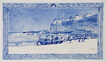 Painted tile of fishermen pulling a boat onto the beach, harbour, Ericeira, Portugal