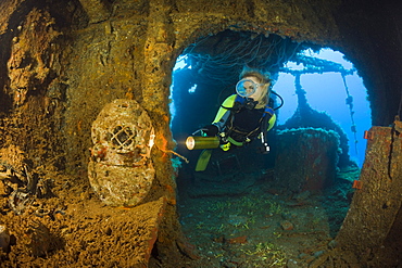 Diver discover Diving Helmet on Brigde of USS Saratoga, Marshall Islands, Bikini Atoll, Micronesia, Pacific Ocean