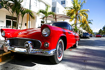 Sports car on Ocean Drive in the sunlight, Miami Beach, Florida, USA