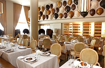 Tables are laid at the deserted La Mer restaurant, Tides Hotel, Ocean Drive, South Beach, Miami Beach, Florida, USA