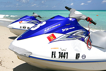 Jetskis on the beach in the sunlight, South Beach, Miami Beach, Florida, USA